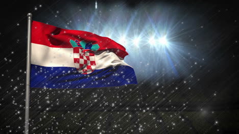 animation of illuminated particles over waving flag of croatia on pole against lights in stadium