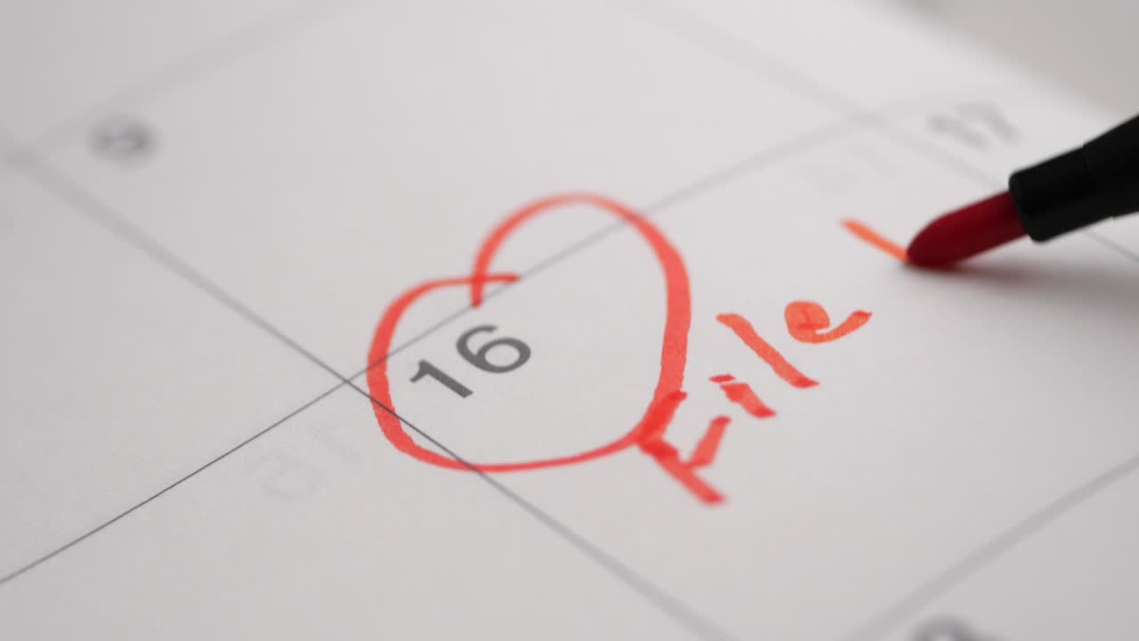 Red Marker Circling Date and Writing 'File Tax Return' on Calendar