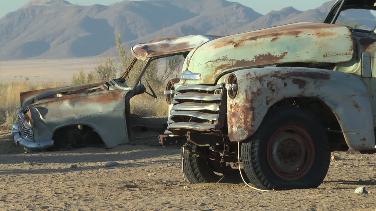 Rusty Abandoned Cars In The Desert. Locked Off