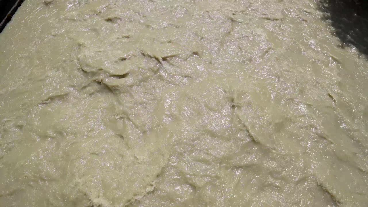 dirty mountain river. Turbulent stream of yellow water