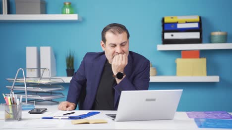 Businessman-biting-his-nails.