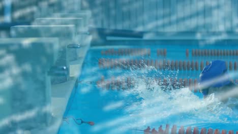 procesamiento de datos contra el nadador masculino nadando en la piscina