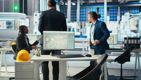 photovoltaics factory manager working with solar engineering team