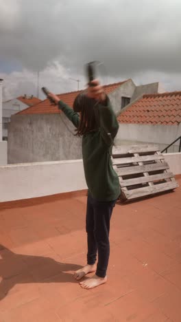 girl skipping rope on a rooftop