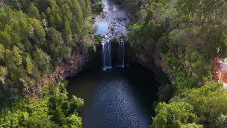 lowering drone shot of dangar falls australia