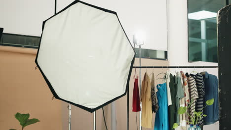 fashion photography studio setup with clothes display