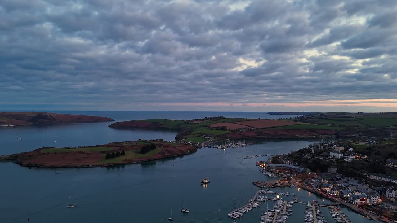 Evening over Kinsale in hyperlapse flying over marina, town and boats. Coastal Ireland