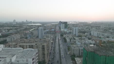 Aerial-Shot-Of-Highway-Running-Through-Chorangi-In-Karachi-With-Residential-Apartments-Under-Construction