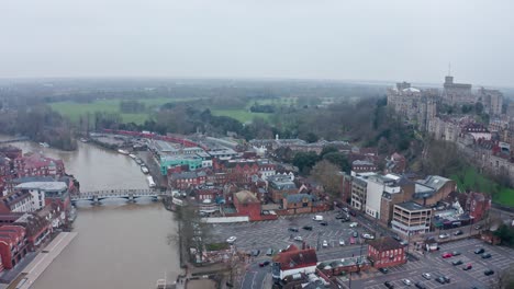 Wide-aerial-drone-shot-of-thames-river-connecting-Eton-and-Windsor