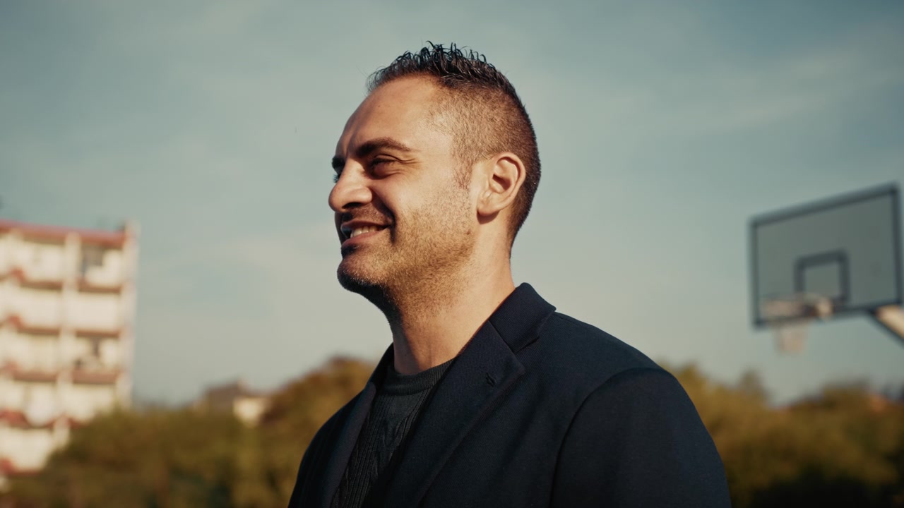serious man starts smiling