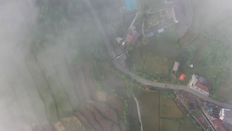 misty aerial view of a rural indonesian landscape