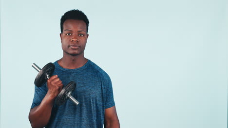 Black-man,-fitness-and-pointing-with-dumbbell