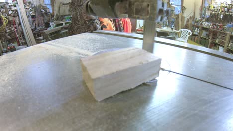 Using-a-bandsaw-to-cut-small-blocks-of-wood