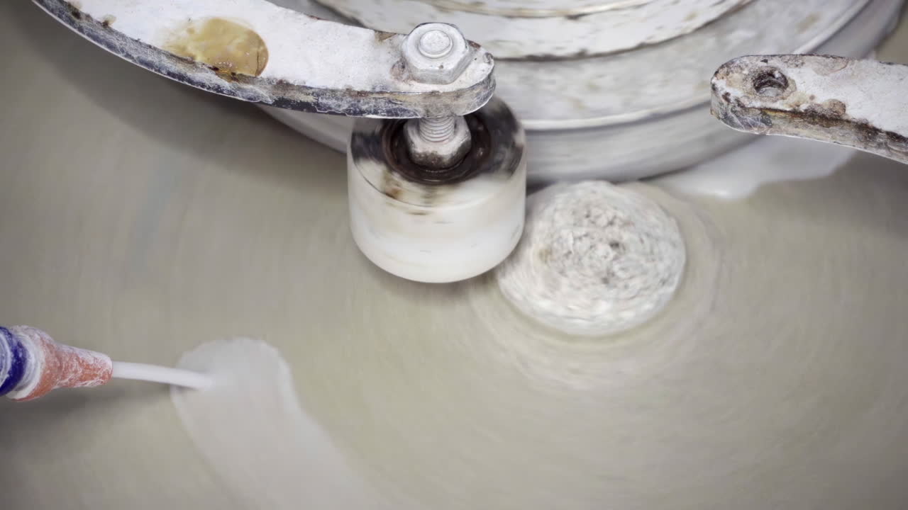 Close up of a white, spinning art installation