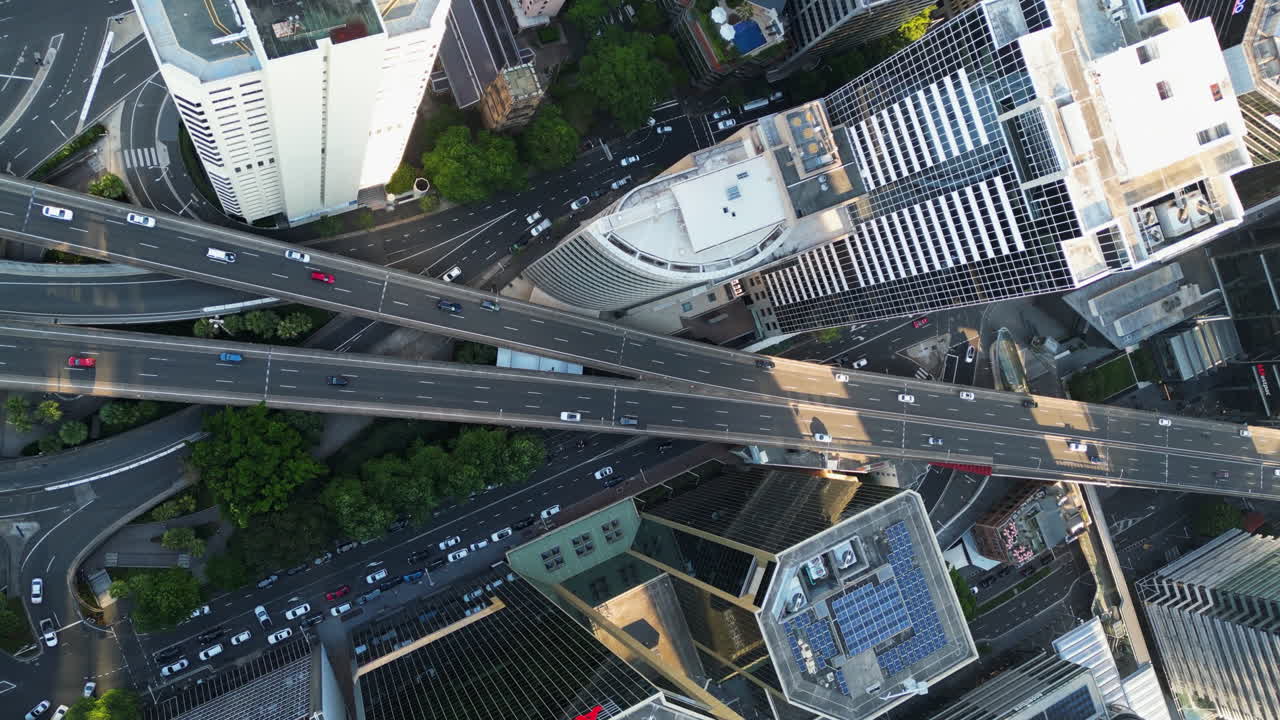 Top down drone shot above traffic in downtown Sydney, sunny day in Australia
