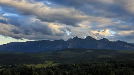 strong wind and clouds flying over tatras seen from lapszanka the slovakian border.