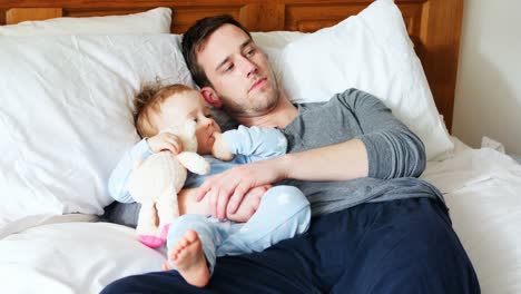 Father-and-baby-boy-relaxing-in-bedroom-4k