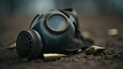 abandoned gas mask and bullets