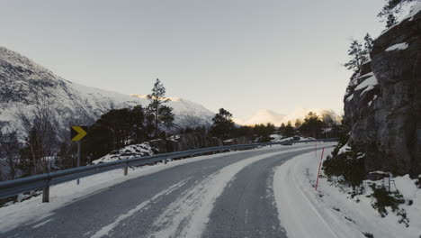 beautiful view of the snowy mountains in a leisurely drive in eresfjord norway - medium shot