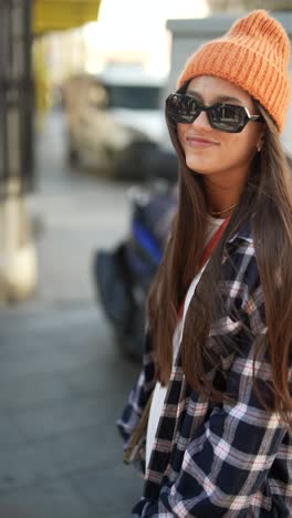 stylish woman in plaid shirt and beanie