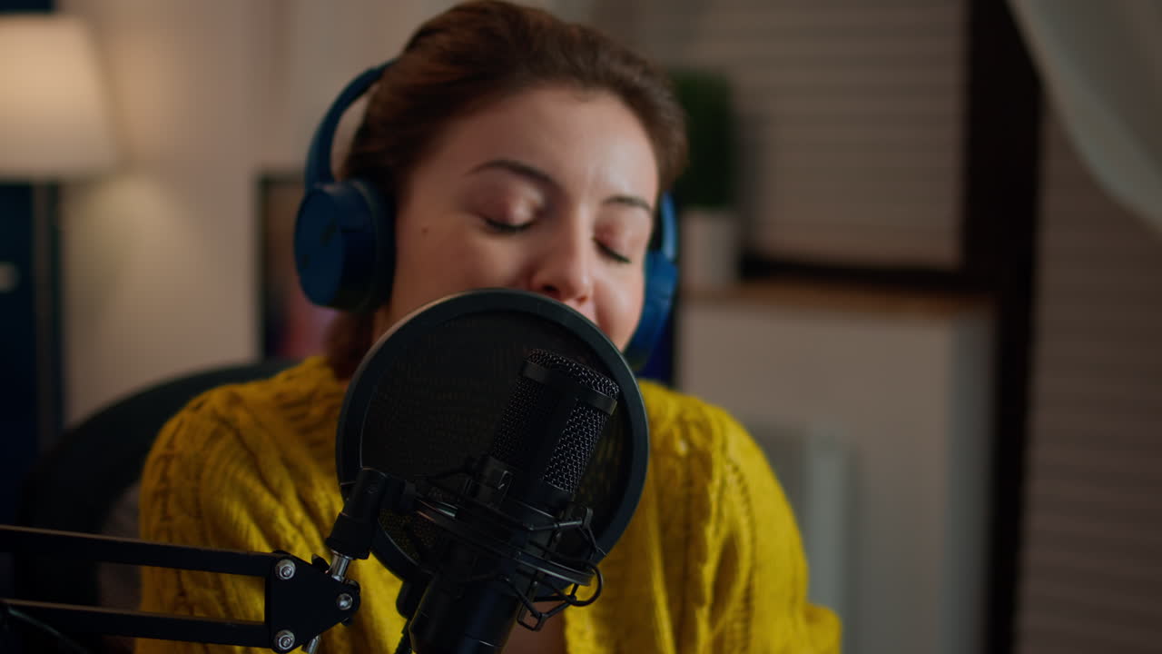 Influencer talking on professional microphone recording vlog