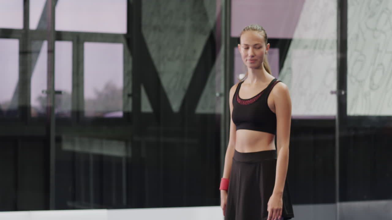 Playing padel tennis, focused diverse athletes hitting ball in modern indoor court