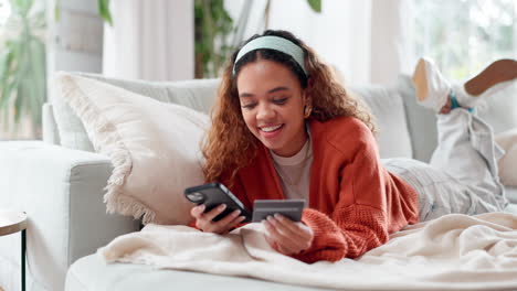 young woman shopping online on sofa