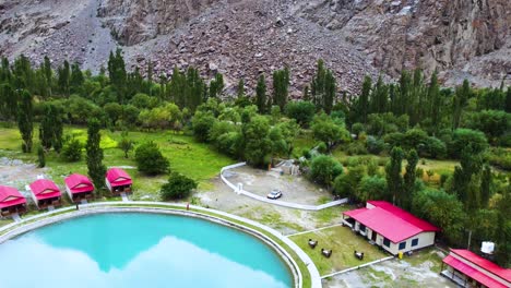 aerial shot of a resort with pool at souq valley in skardu, pakistan.