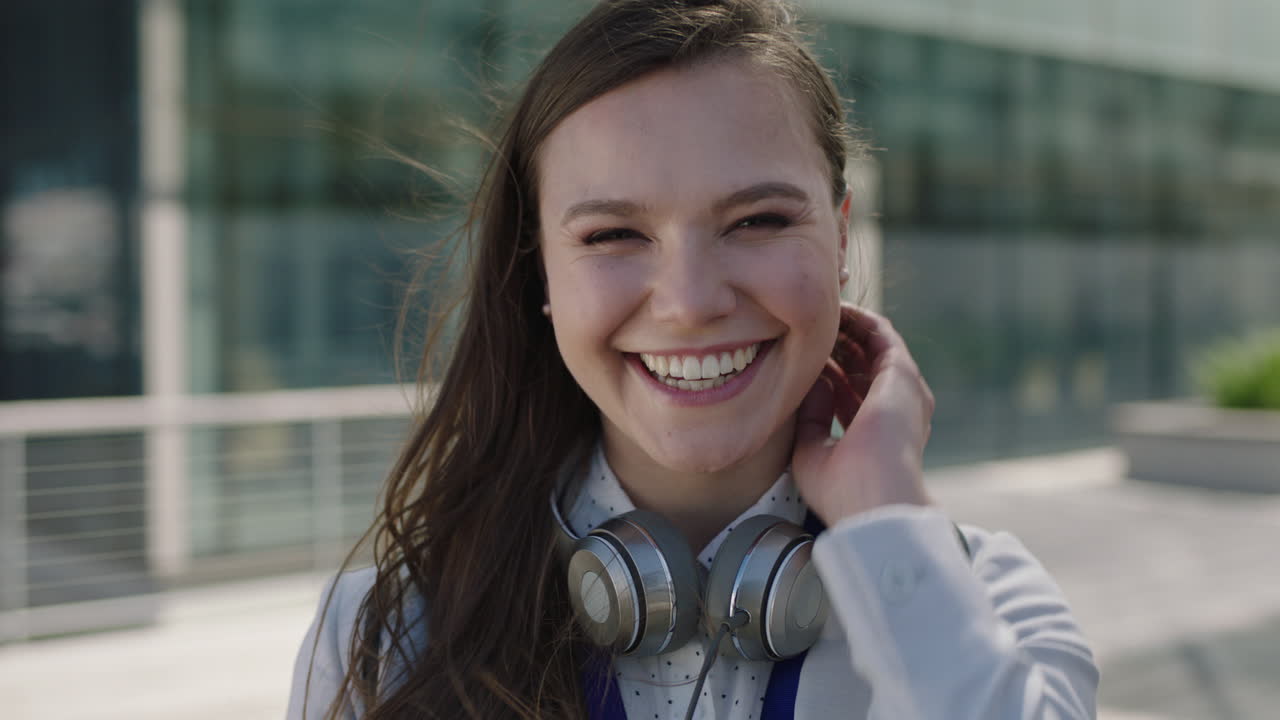 portrait of beautiful young lively woman smiling at campus intern laughing office corporate outdoors
