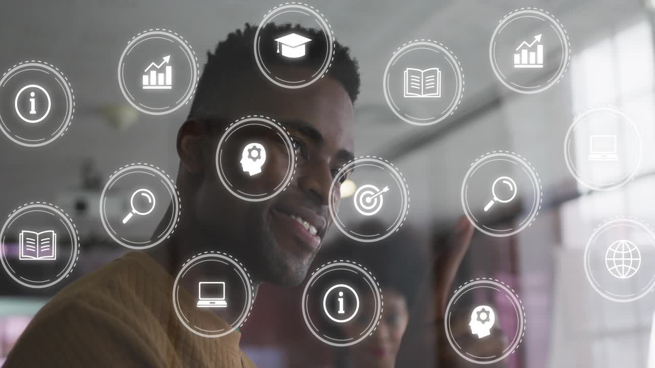 Man turning toward coworker and laughing in office, AR icons appearing on glass guiding tech demo