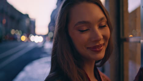 gorgeous model posing dark street looking camera close up. happy girl tourist