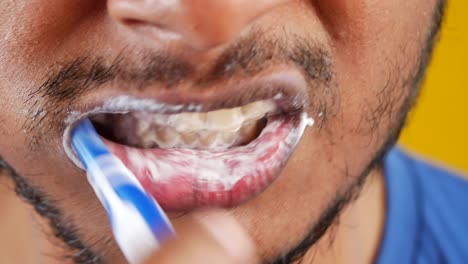 man brushing his teeth