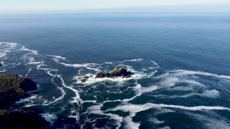 4K-Drone-footage-of-Lands-End-cliffs-with-a-small-island-in-the-middle-of-the-frame