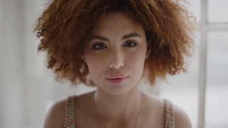 portrait-close-up-of-young-beautiful-woman-looking-serious-at-camera-cute-mixed-race-female-student-afro-hairstyle