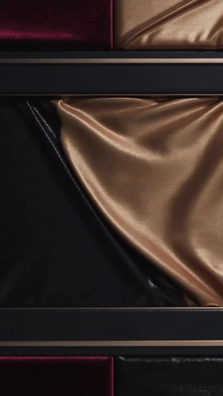 Vertical video: Sparking golden dot elongating, rising on wall, peeling black cover, revealing gold