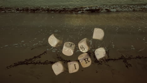 floating lettered dice animation over sandy beach with gentle ocean waves