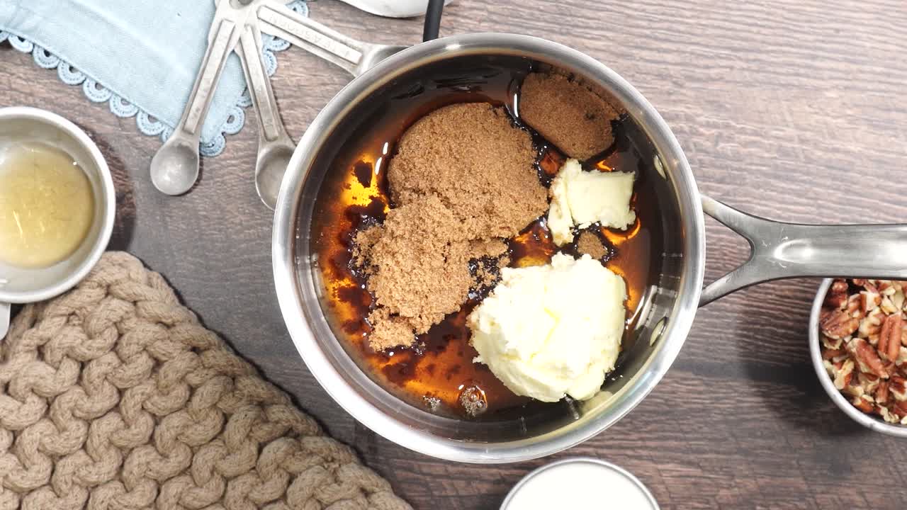 Baking delicious caramel pecan brownies. In a sauce pan adding milk or heavy cream to the other ingredients. Freshly baked gooey chocolate brownies with sweet caramel and nutty pecans.