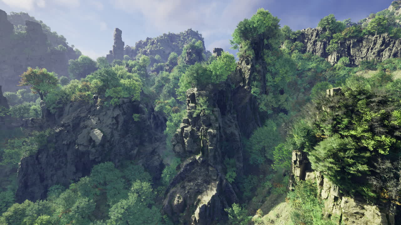 Lush green landscape with rocky formations and dense vegetation in ...