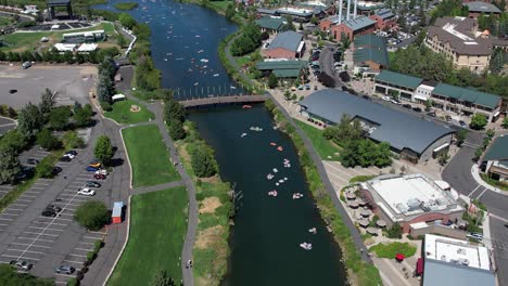 people floating down the deschutes river in bend, oregon near the old mill during the summer