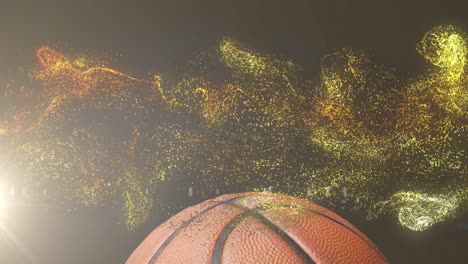 Animation-of-glowing-gold-particles-moving-over-basketball