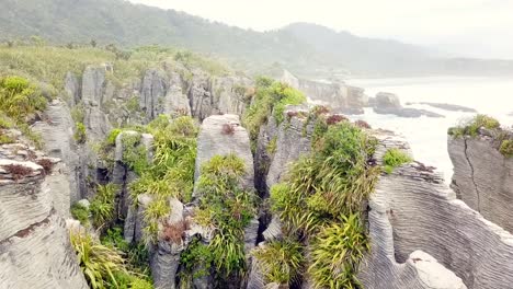 Drone-view-of-the-pancake-rocks-at-Dolomite-point,-Punakaiki,-New-Zealand