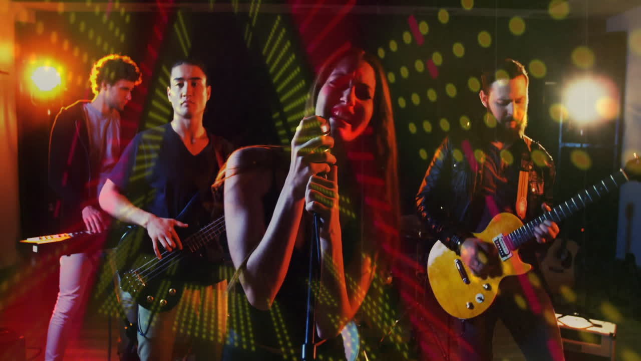 Band performing live music on stage with vibrant lights, showing animated guitar and bass waves