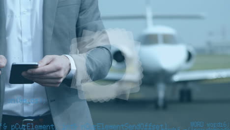 abstract shape and data processing on mid section of businessman using smartphone on airport runway