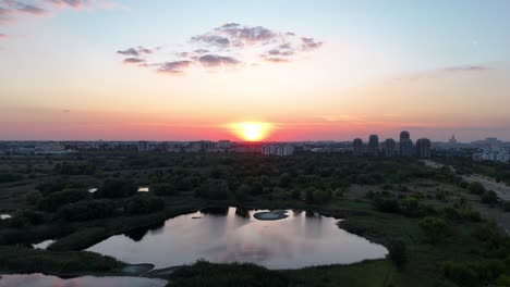 drone view over vacaresti delta at sunset, cityscape, bucharest, romania