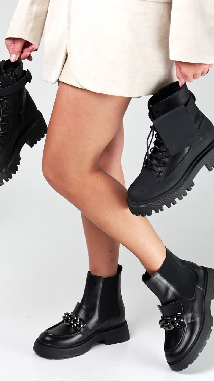 Fashionable luxury lifestyle footwear posing. Women shoe store showroom trying. Vertical video