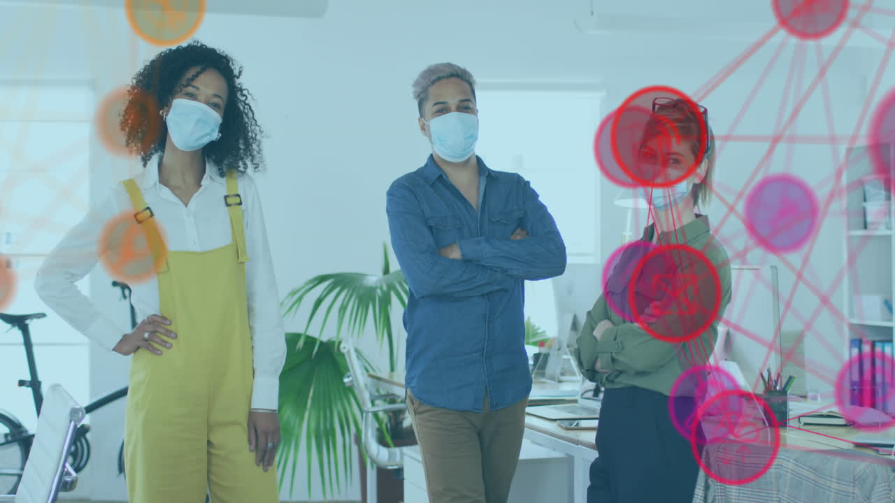 Animation of digital interface showing statistics with colleagues in office wearing face masks