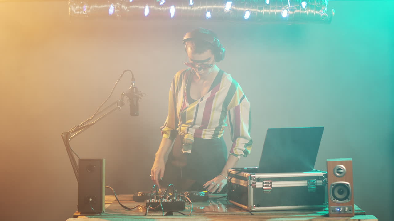 Tired artist drinking coffee and yawning