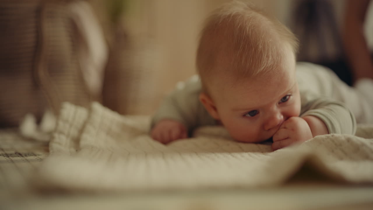 Cute baby lying on blanket