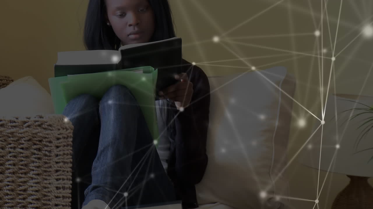 Animation of a girl  reading a book over a web of connections in the background