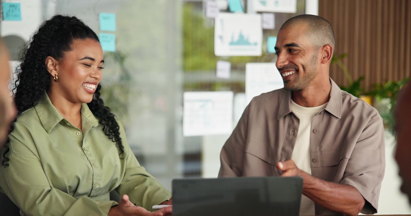 Diverse Business Team Collaborating on Project in Modern Office